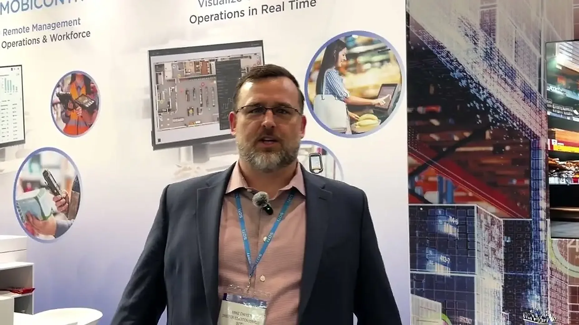 Mike Dwyer of SOTI on their Booth Exhibits stand at Retail Technology Show, London