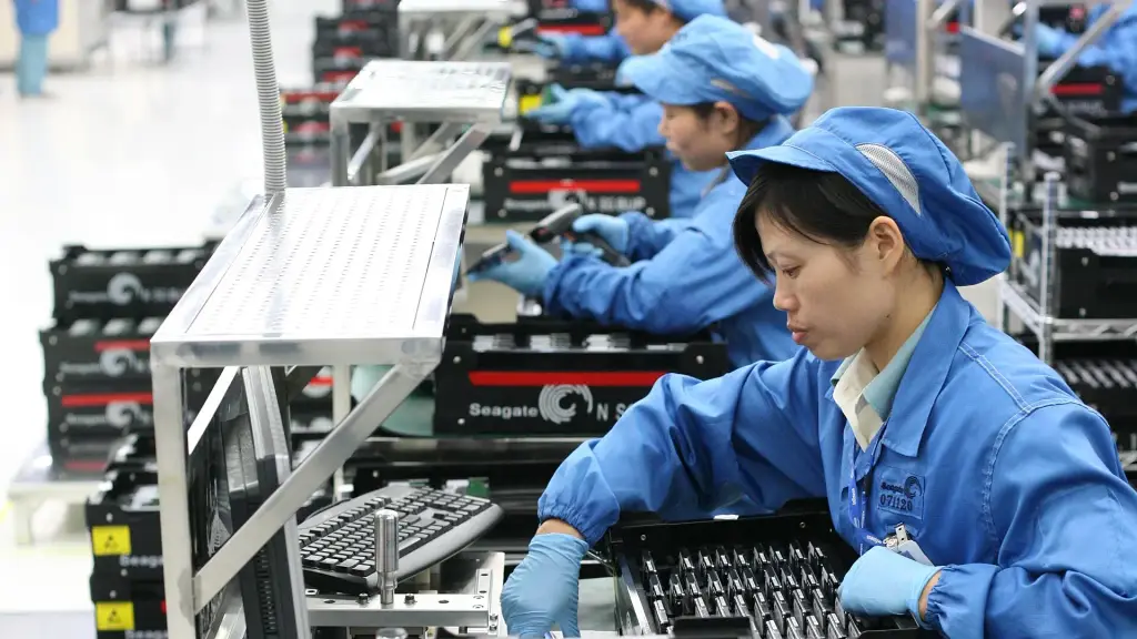 Chinese factory workers in a tech factory.