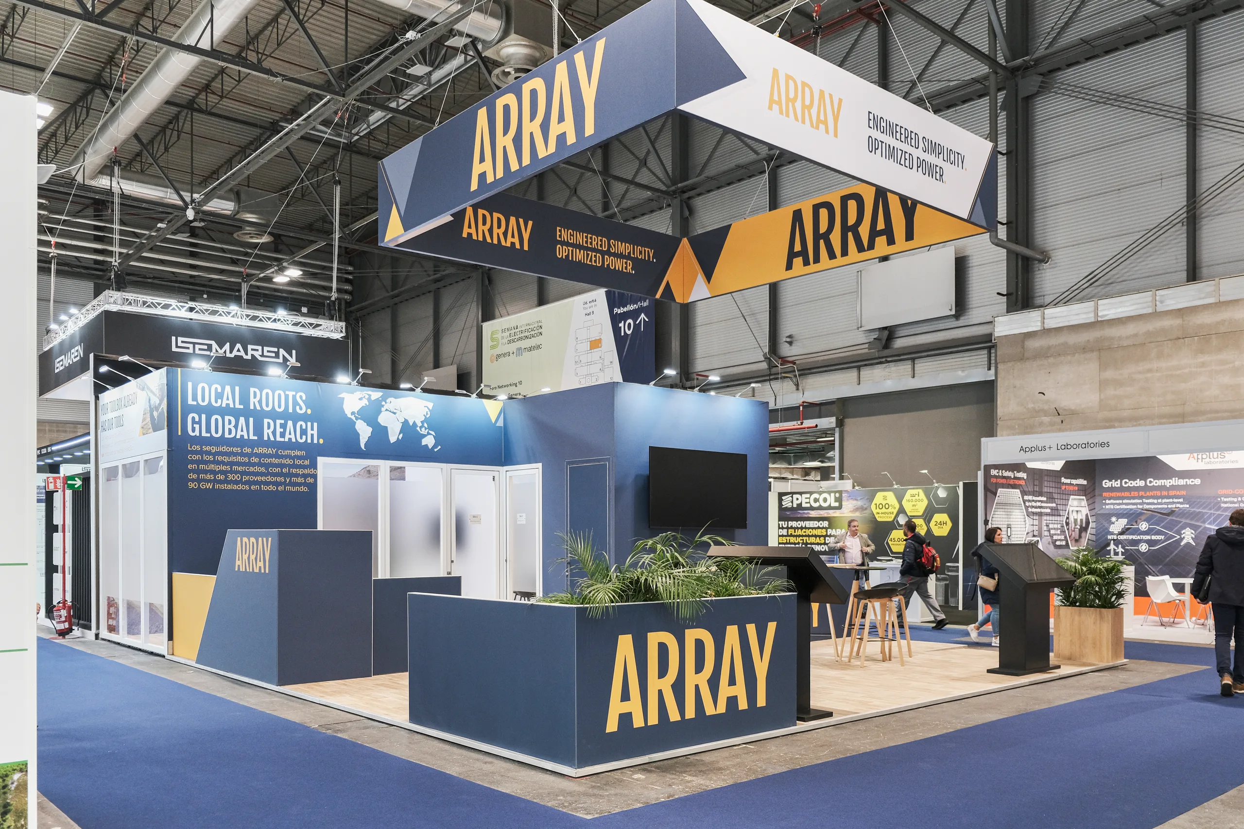 Custom-designed exhibition stand with sculpted branded walls and integrated lighting