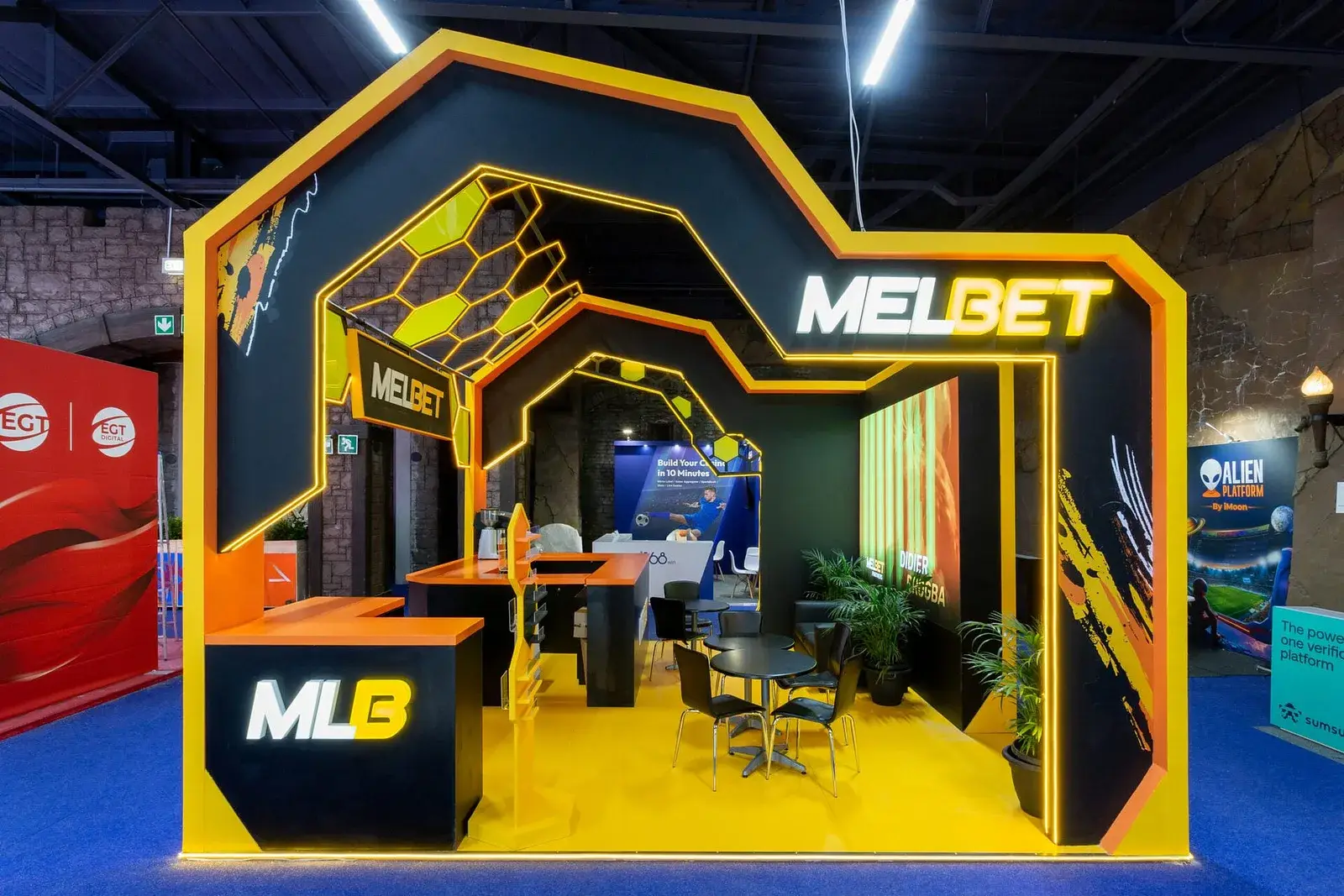Large-format LED screens and audio-visual systems integrated into an exhibition stand