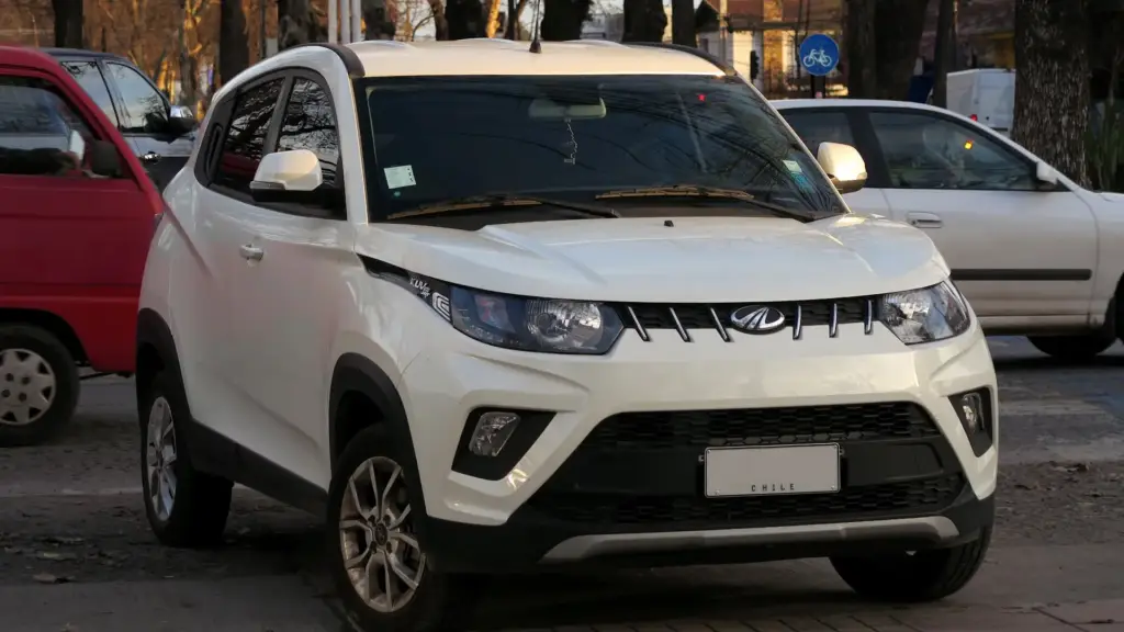 A white Mahindra KUV car.